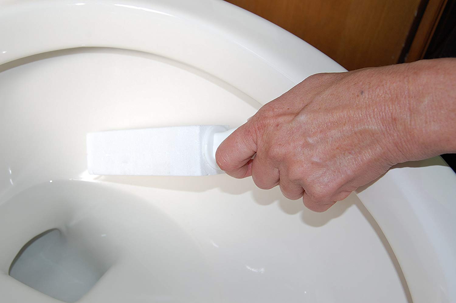 How to remove mineral deposits from the the toilet with a pumice stone