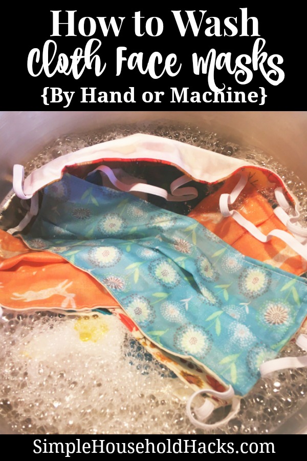 cloth face masks soaking in a sink of hot water and laundry soap